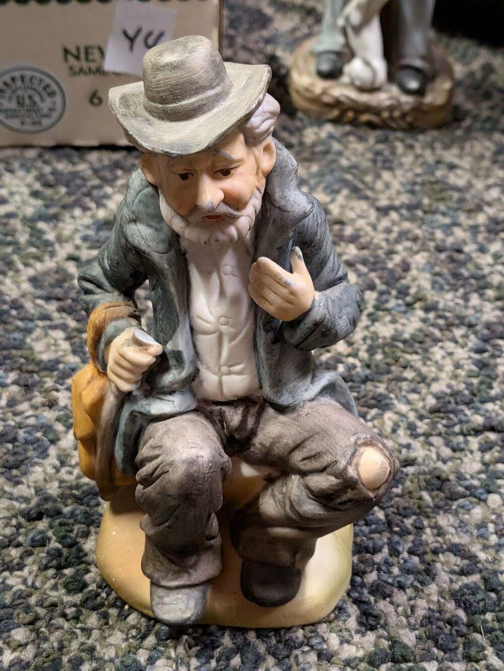 Vintage Ceramic Hobo Tramp Figurine Old Man Sitting with Pack and Patchy Clothes